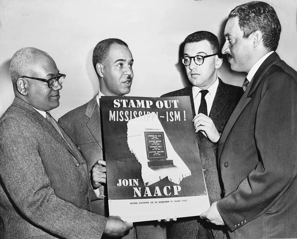 NAACP leaders with a 1956 campaign poster against racial bias in Mississippi, Thurgood Marshall among them